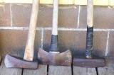 Sledge hammer, 3 ft. long and handle is bent; splitting maul; two bit axe.