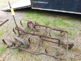 Spring tooth drag with metal wheels. Nice for pulling behind your ATV. Approx. 43