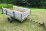 Two wheel metal framed trailer with wood sides and bottom. Approx. 7' x 4' x 17