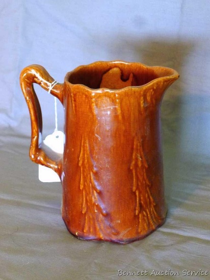 Ceramic pitcher stands 7" tall, no crack or chips noted.