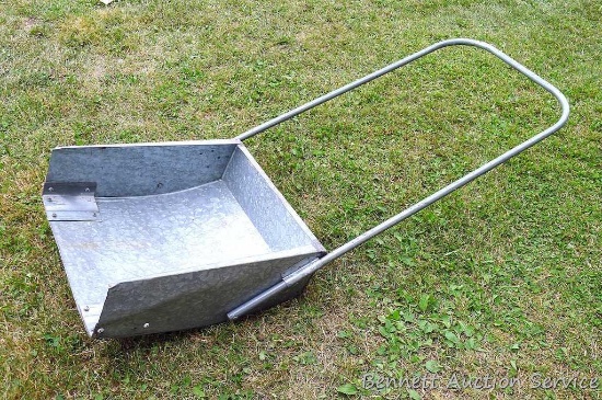 Galvanized snow scoop is 22" wide and has a repaired edge.