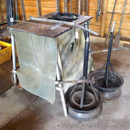 Homemade table saw has handles and wheels for easy moving. Includes 2 homemade adjustable stands.