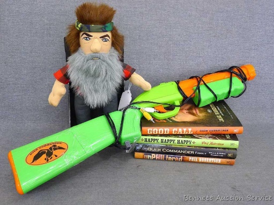 Duck Dynasty talking doll (appears new); Duck Commander hooks up to tv; four books incl. Good Call,