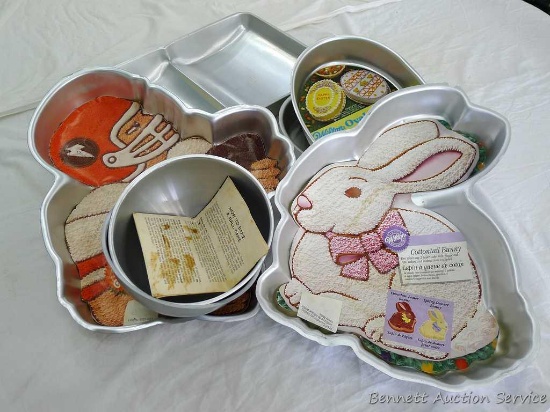 Assorted Wilton cake pans incl. book, rabbit, football player and more.