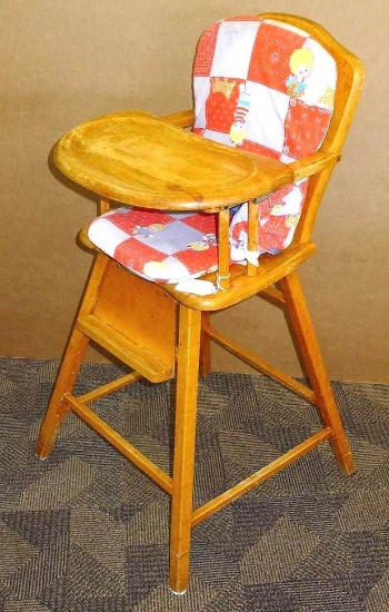 Vintage wooden high chair with foot rest and padded cushions. Approx. 18" w x 18" d x 38" h. Shows