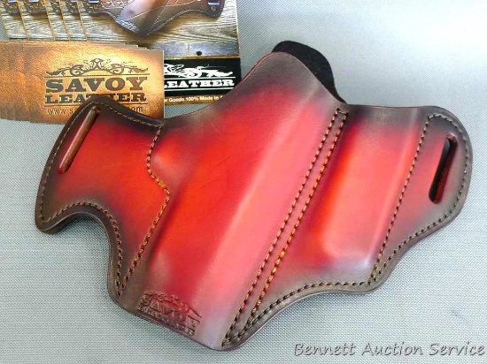 Savoy Leather pistol holster is 11" x 8" and was donated by Savoy Leather.