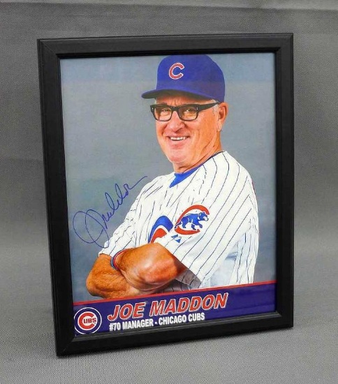 Framed and autographed 8" x 10" picture of Joe Maddon, manager of the Chicago Cubs. Donated by