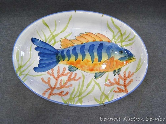 Fish platter is 16" x 11" and includes a hanger. Donated by Diane Mondeik