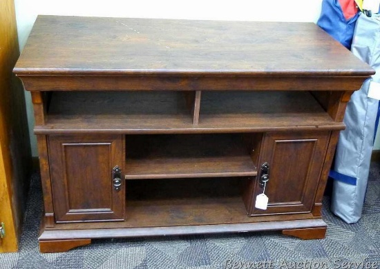 Wooden entertainment cabinet is 43-1/2" x 20" x 29" tall, has some loose molding and shows light