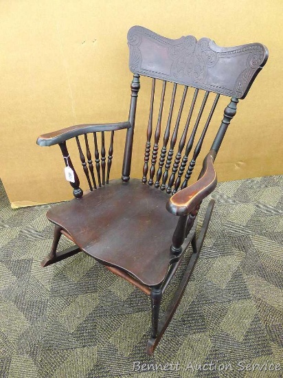 Vintage wooden rocking chair is sturdy, shows wear on arms, is 24" x 36" x 18" deep and was donated