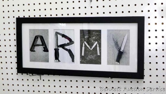 Framed "Army" print with each letter a collage of weaponry is 21-1/2" x 9-1/2" and was donated by