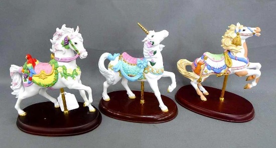 Three Lenox carousel horses including The Carousel Tropical Horse, The Carousel Unicorn, The Western