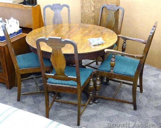 Antique pedestal table with five antique chairs in a complimentary design. Table comes with two