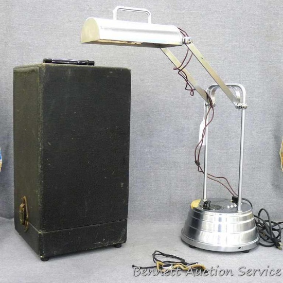 1941 Sun Kraft therapy lamp; includes goggles and carrying case; lamp measures 8" diameter by 17"