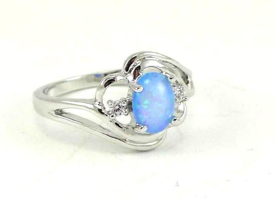 Seller's note states "Oval cut blue fire opal ring, size 8".
