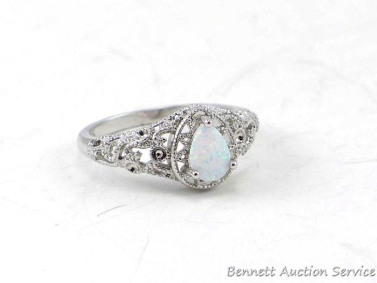 Seller's note states "Pear cut white fire opal ring, size 8".