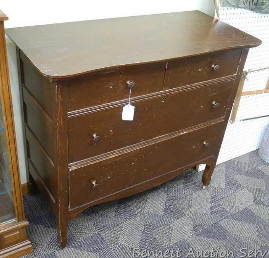 Antique dresser has updated knobs. Dresser is sturdy and in overall good condition with four