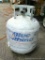 No shipping. New style 20 lb. propane cylinder has 10 lbs, 11 oz. of gas.