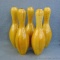Five wooden bowling pins with clear varnish, stand 15