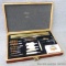 Universal gun cleaning kit in wooden case. Will clean shotguns and rifles. Has brass rods.