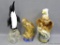 Three bird decanters including eagles and a penguin. Tallest measures approx 15