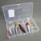 5 fishing lures in a Plano box measuring approx 6-1/2