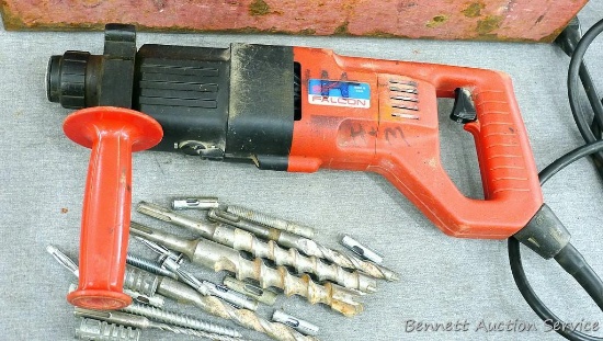 Milwaukee Falcon heavy duty 3/4" rotary hammer drill runs and comes with bits, anchors and case.