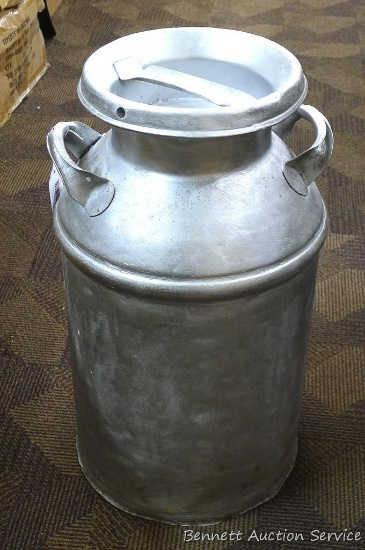 Vintage milk can that has been painted. Approx. 24" high. Inside is in fair shape.