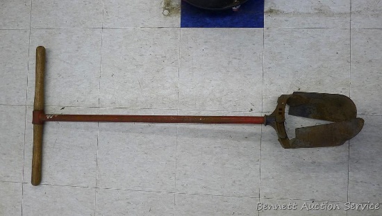 Adjustable post hole digger is about 4' long and is currently set up for a 8" hole.