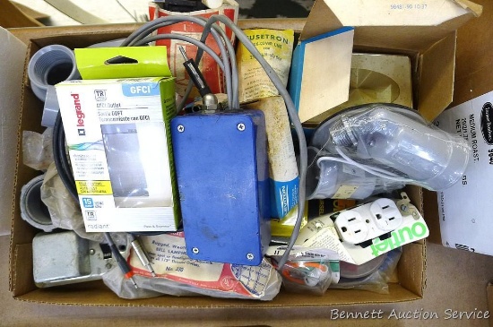 Assortment of electrical components incl. outlets, switches and more.