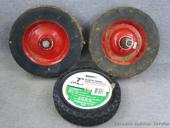 Pair of hard rubber wheels, 8", with grease fitting. Appear in good shape.