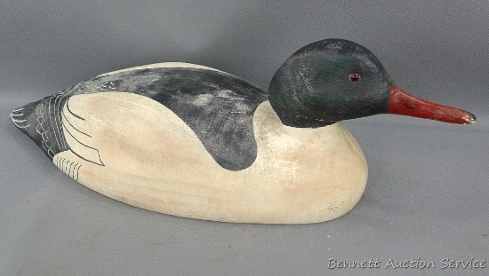 Herter's Inc. 1893 wooden duck decoy with glass eyes. Appears head has been repaired. Approx. 19" x
