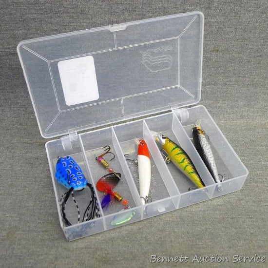 5 fishing lures in an approximately 6-1/2"x 3-3/4" Plano box. Includes spinners and a frog lure. All
