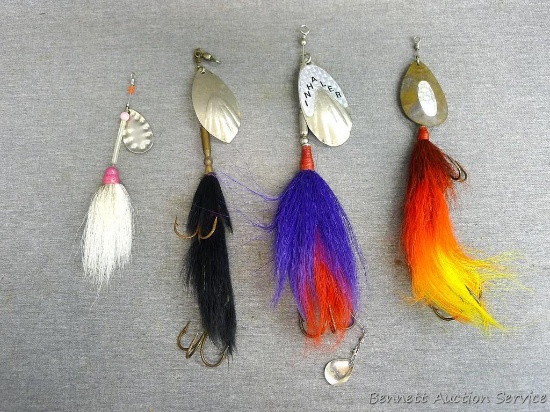 4 bucktail lures, longest is approx 9". One spoon is marked 'Inhaler'.