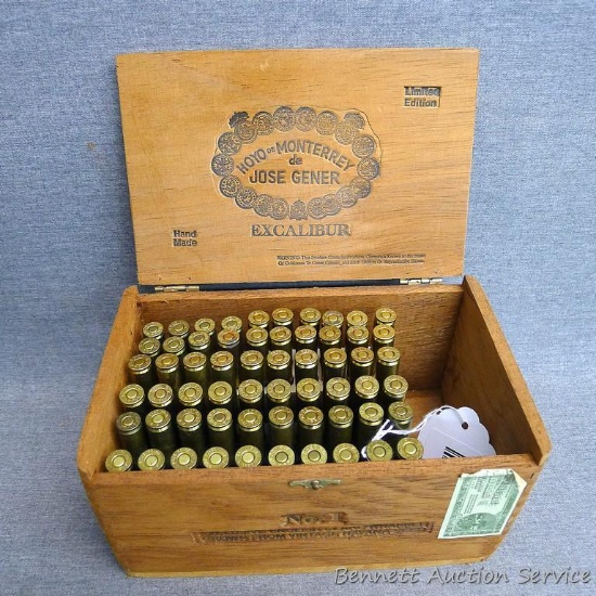 Sixty SPRG 30-06 rifle shells in a cigar box measuring approx 8"x 5"x 4".