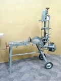 Horizontal metal cutting band saw is well built and runs, approx. 4 ft tall with saw head up, unique