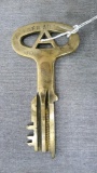 This large brass key was carried so much that most of the identifying characters are worn off.