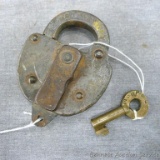 Old railroad switch lock with key from the Minneapolis, St. Paul and Sault St. Marie Railway. Lock