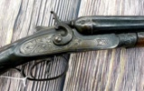 Antique exposed hammer 12 gauge side by side shotgun is marked T.Parker Belgium Royal Damascus. Gun