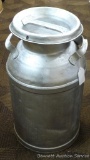 Vintage milk can that has been painted. Approx. 24