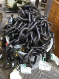 Assortment of different lengths of chain, some with hooks.