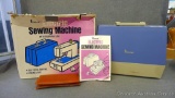 Vintage Penney's child's electric sewing machine with case. Model No. 921-3090. When plugged in the
