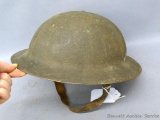 WWI Doughboy helmet marked Z0196, hand written name of Ed Schepp, liner included. Good shape for