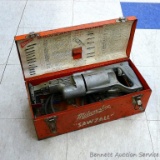 Vintage Milwaukee Sawzall is all metal and comes with original case and some blades. Runs.