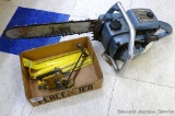 Homelite XL-12 chainsaw with chain sharpener and files. Chainsaw turns over and has