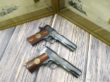 Exceptional pair of Colt 1911 pistols with matching serial numbers commemorating WWI battles. One