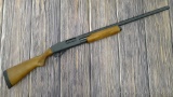 Remington 870 Express Magnum 12 gauge shotgun with raised rib and checkered hardwood stocks. 28