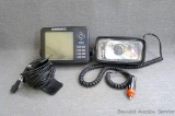 Lowrance fish locator with transducer and hand held 12 volt portable light.