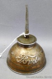 Small oil can marked 'Ford'. Can is in good overall condition and measure 5
