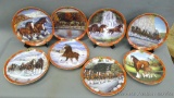 Eight plate collection featuring the 'Pride of Budweiser' from Danbury Mint. Includes COAs.